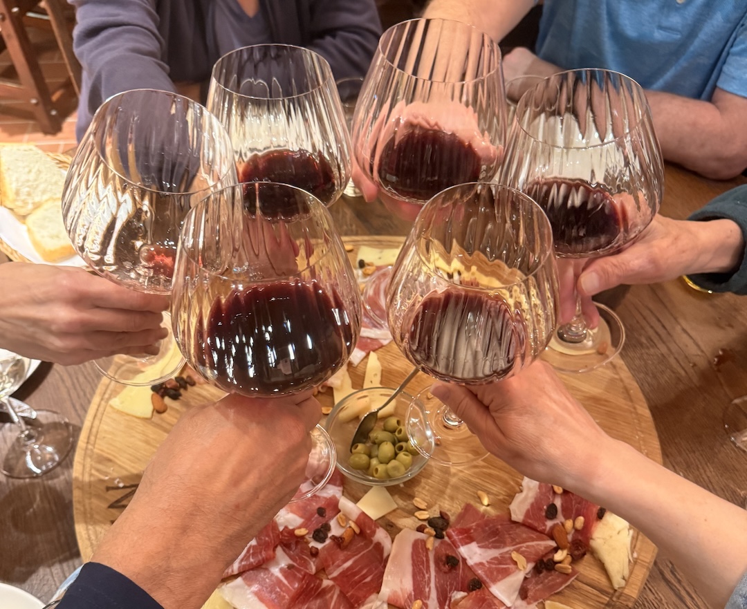 Group Toasting with Red Wine